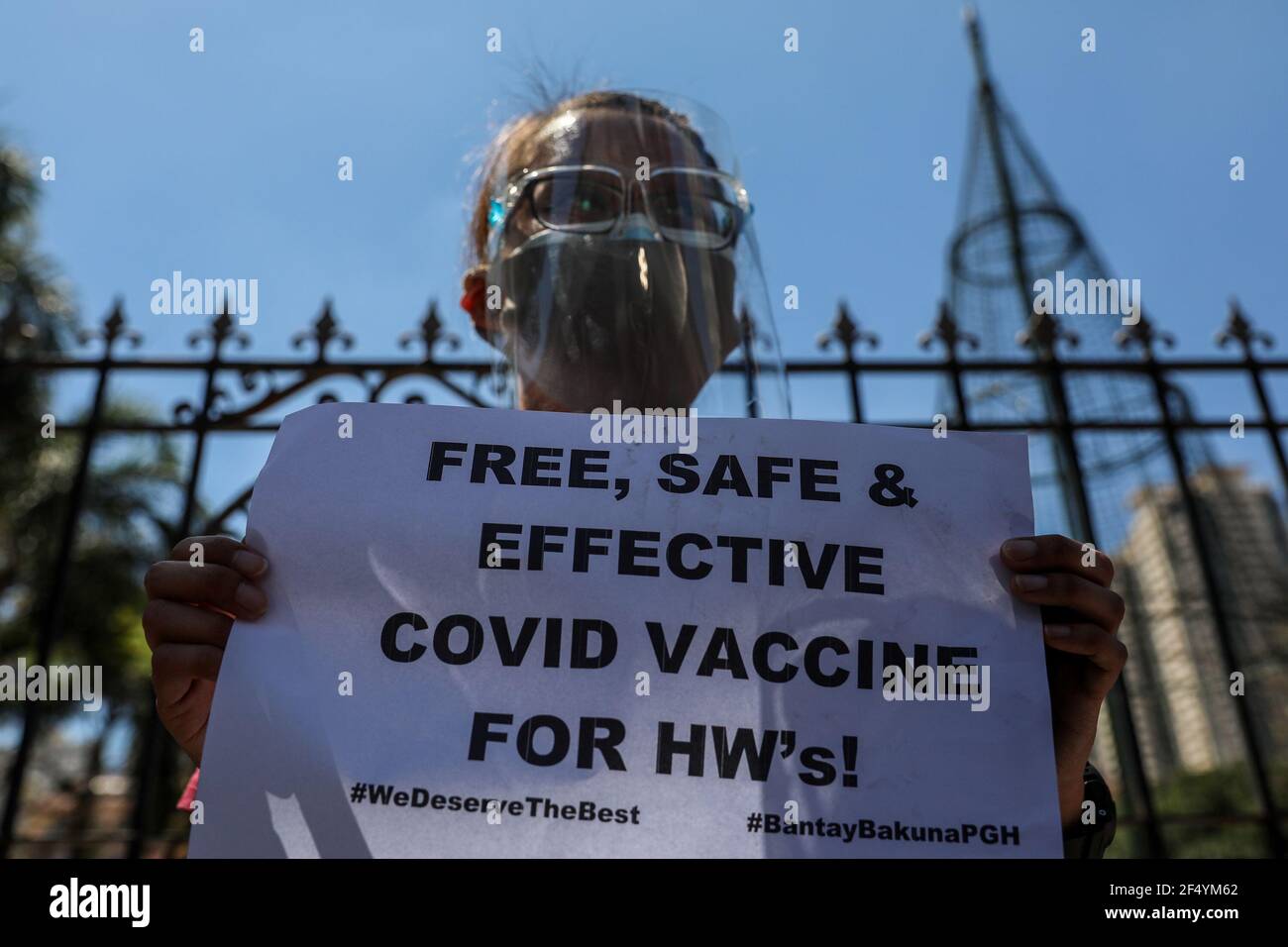 Healthcare workers call for a free, safer and effective COVID-19 vaccine during a protest outside the Philippine General Hospital in Manila. Activists along with medical workers and students demanded for a free and safer COVID-19 vaccine for health care workers, who continue to be at risk amid the surge of coronavirus cases in the country. The government, meanwhile, faced criticism for failing to immediately launch a vaccination program, leaving the Philippines the only ASEAN member with no COVID-19 vaccines that is expected to arrive in late February. Philippines. Stock Photo