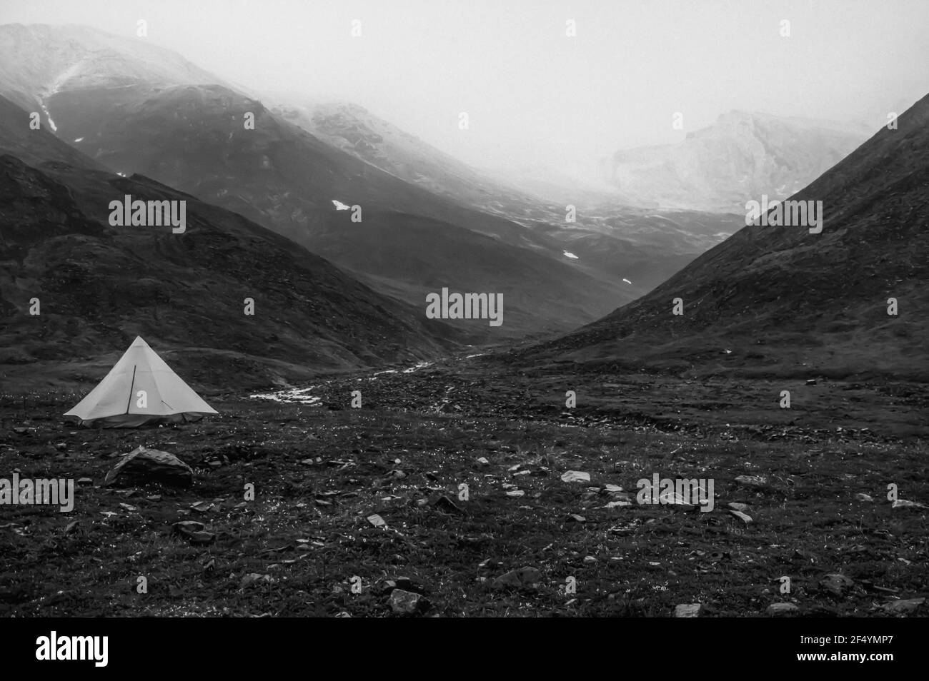 Backpacking tent oat edge of mountains in the arctic tundra of Gates of