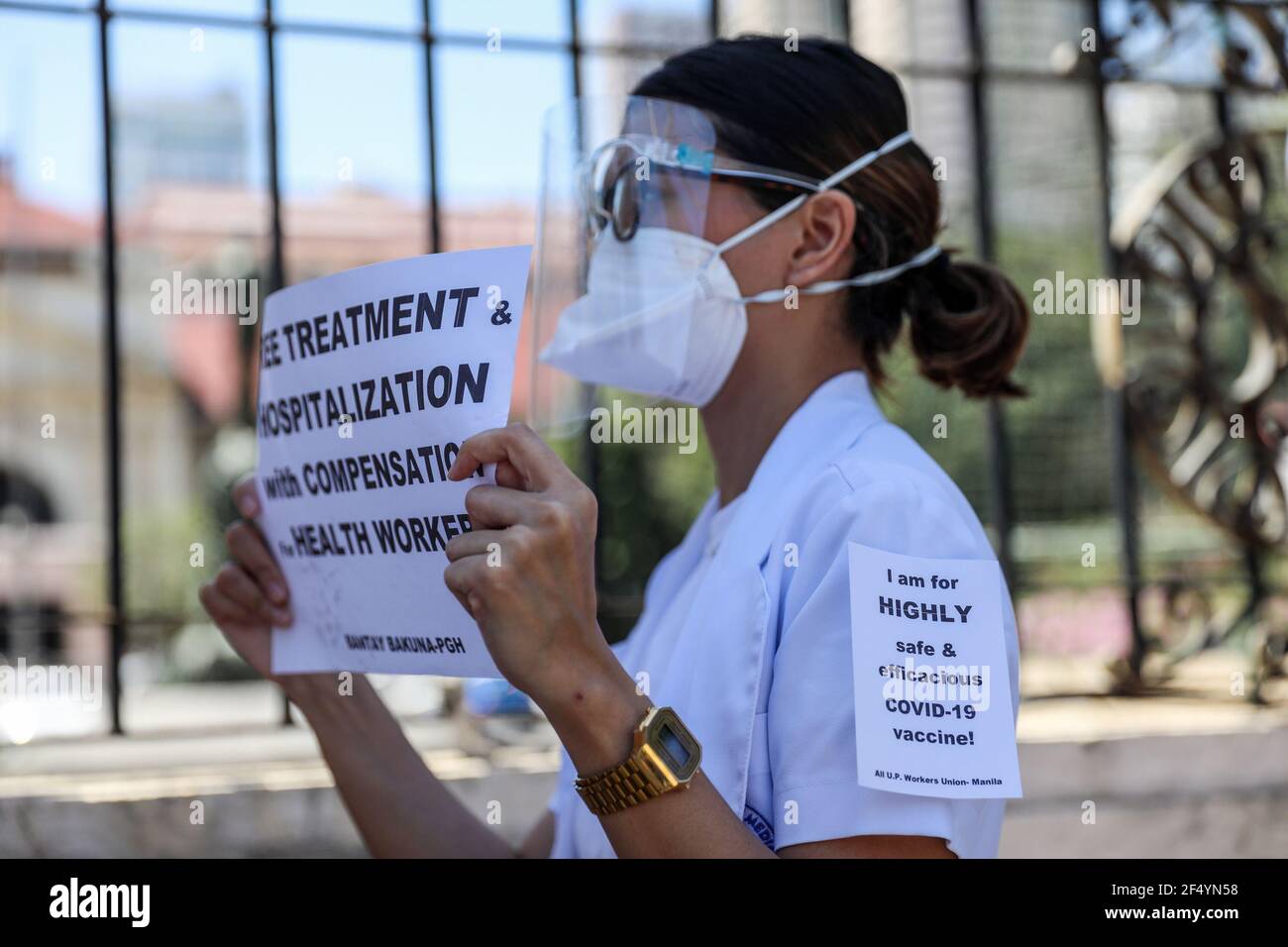 Healthcare workers call for a free, safer and effective COVID-19 vaccine during a protest outside the Philippine General Hospital in Manila. Activists along with medical workers and students demanded for a free and safer COVID-19 vaccine for health care workers, who continue to be at risk amid the surge of coronavirus cases in the country. The government, meanwhile, faced criticism for failing to immediately launch a vaccination program, leaving the Philippines the only ASEAN member with no COVID-19 vaccines that is expected to arrive in late February. Philippines. Stock Photo