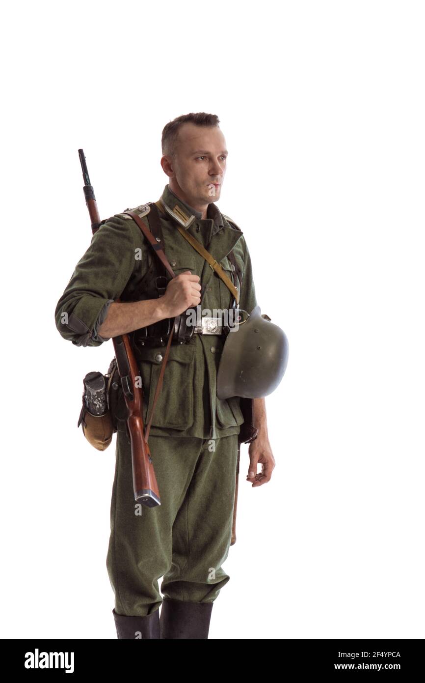 Man actor in historical military uniform as an soldier of the German Army  during World War II with a machine gun posing against white background  Stock Photo - Alamy