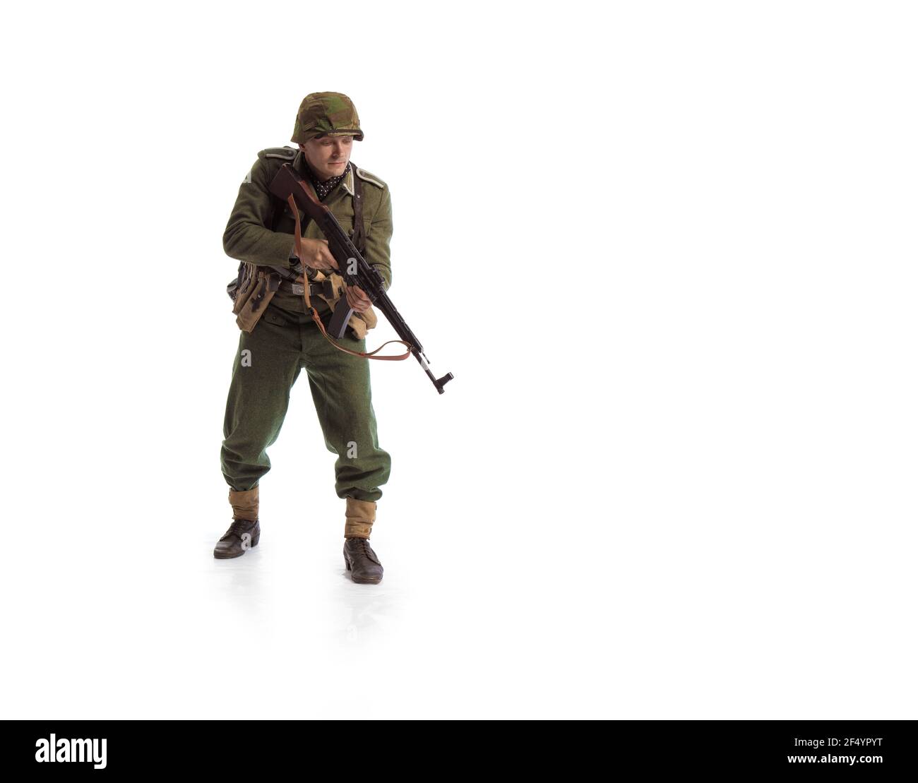 Man actor in the movie role of an military man with a machine gun ...