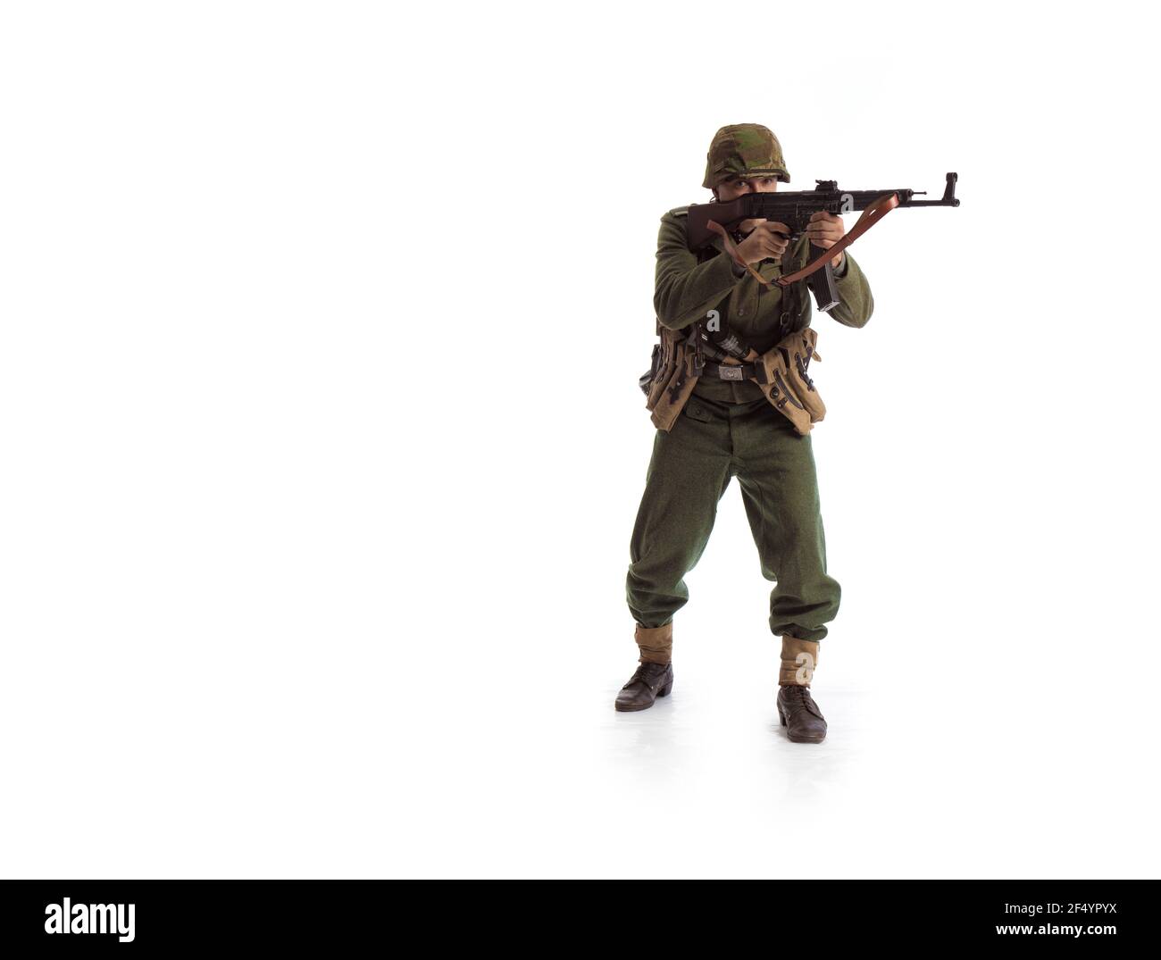 Man actor in the movie role of an military man with a machine gun ...