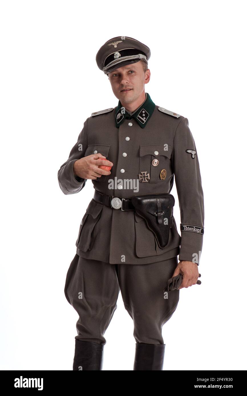 Man actor in historical military uniform as an officer of the German Army  during World War II, posing on a black background in a blue scenic light  Stock Photo - Alamy
