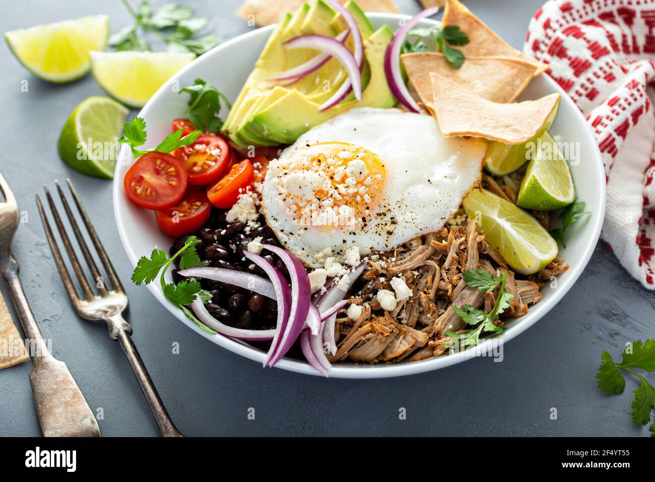 Breakfast burrito bowl with pork carnitas and rice Stock Photo Alamy