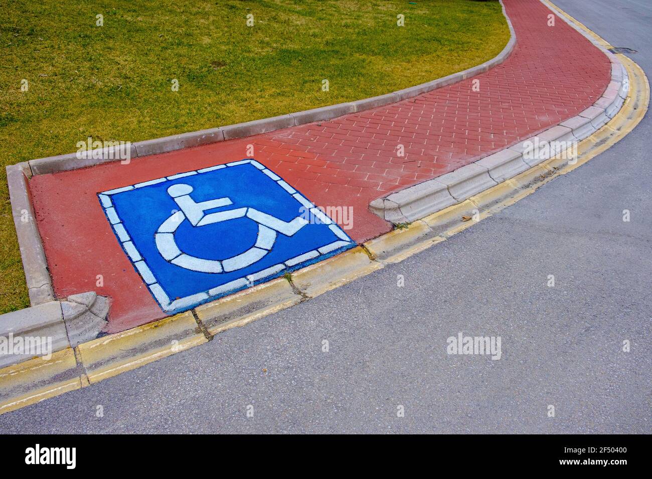 wheelchair way entarence at sidewalk Stock Photo