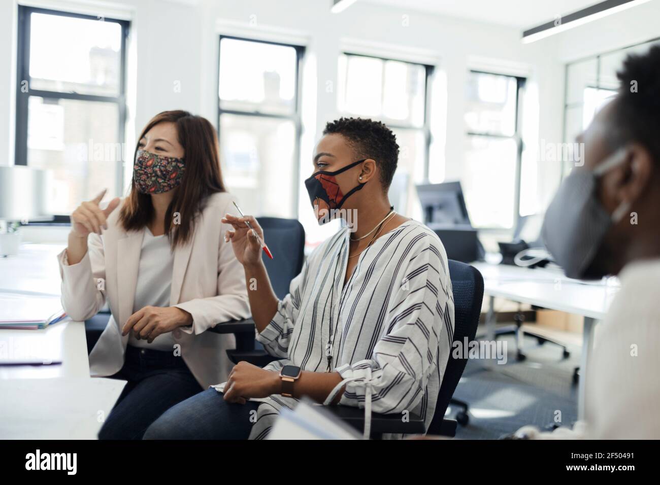 Multiethnic business people face mask hi-res stock photography and ...