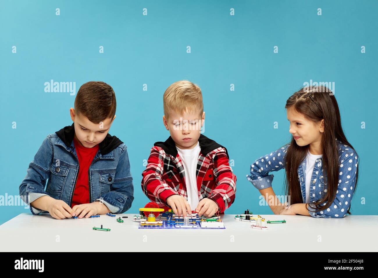 children playing with electronic constructor at studio Stock Photo
