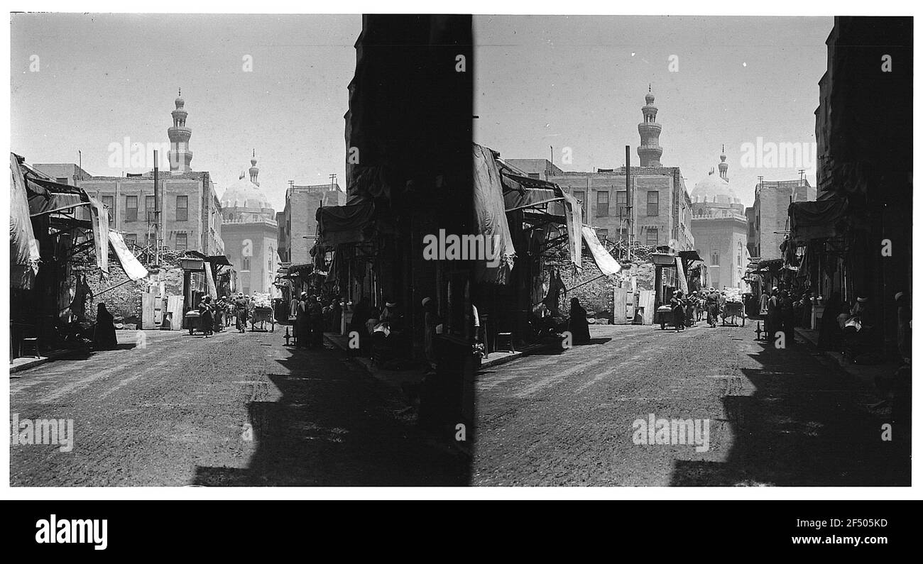 Cairo (Egypt). Road with road dealers, passersby and fleet. View to