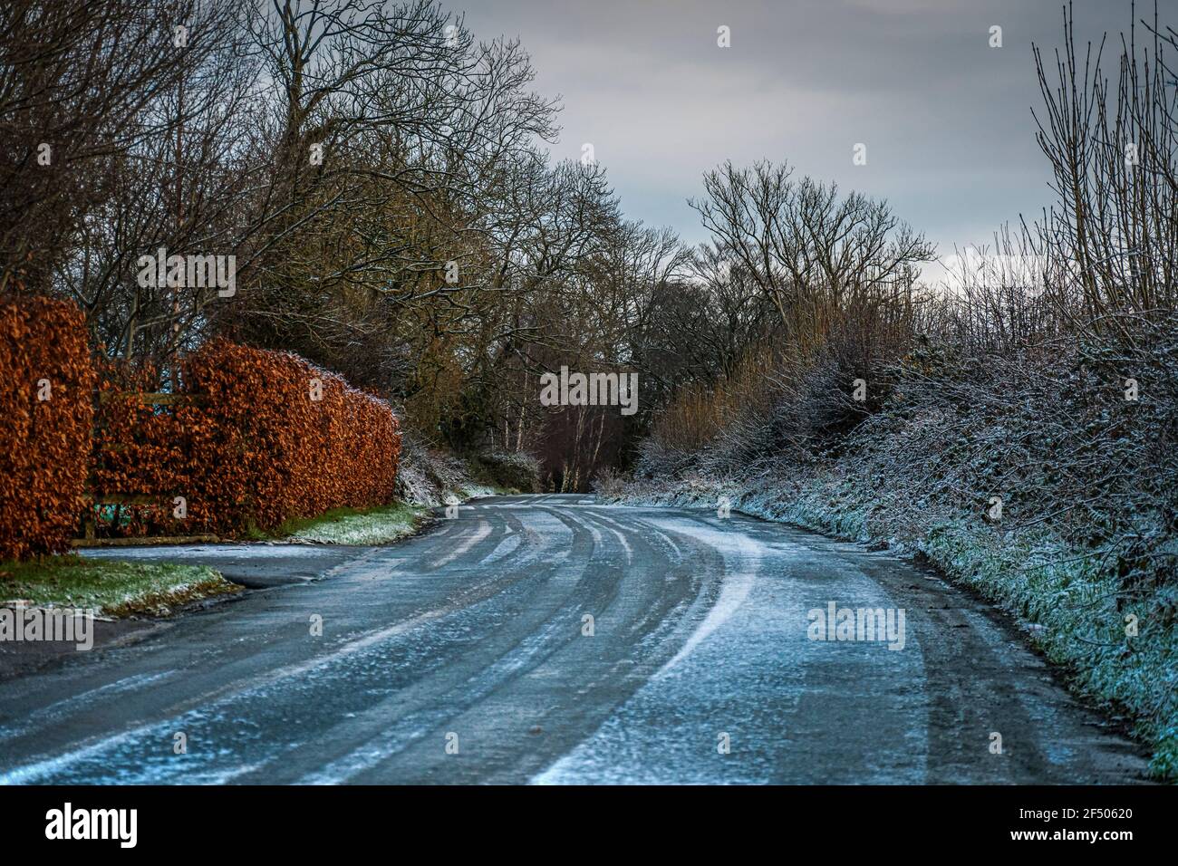 Winter in Ireland. Light snow covering countryside road in co. Wexford