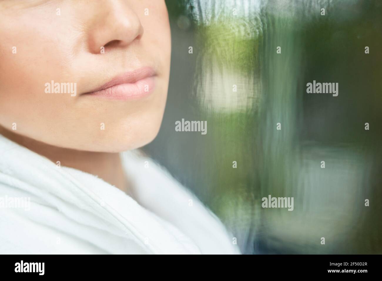 Close up lips of woman at window Stock Photo