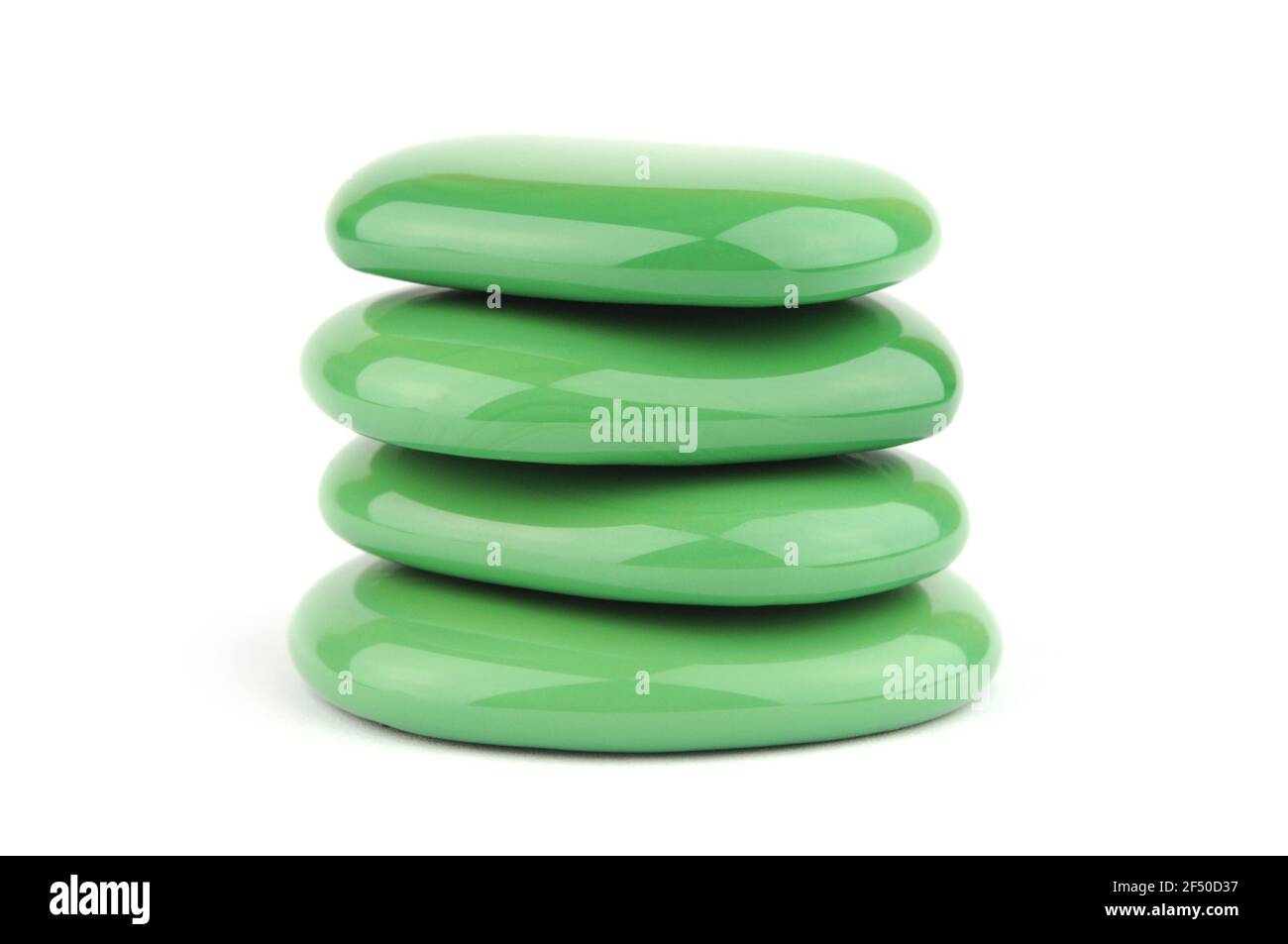 Green spa stones isolated on white background Stock Photo - Alamy