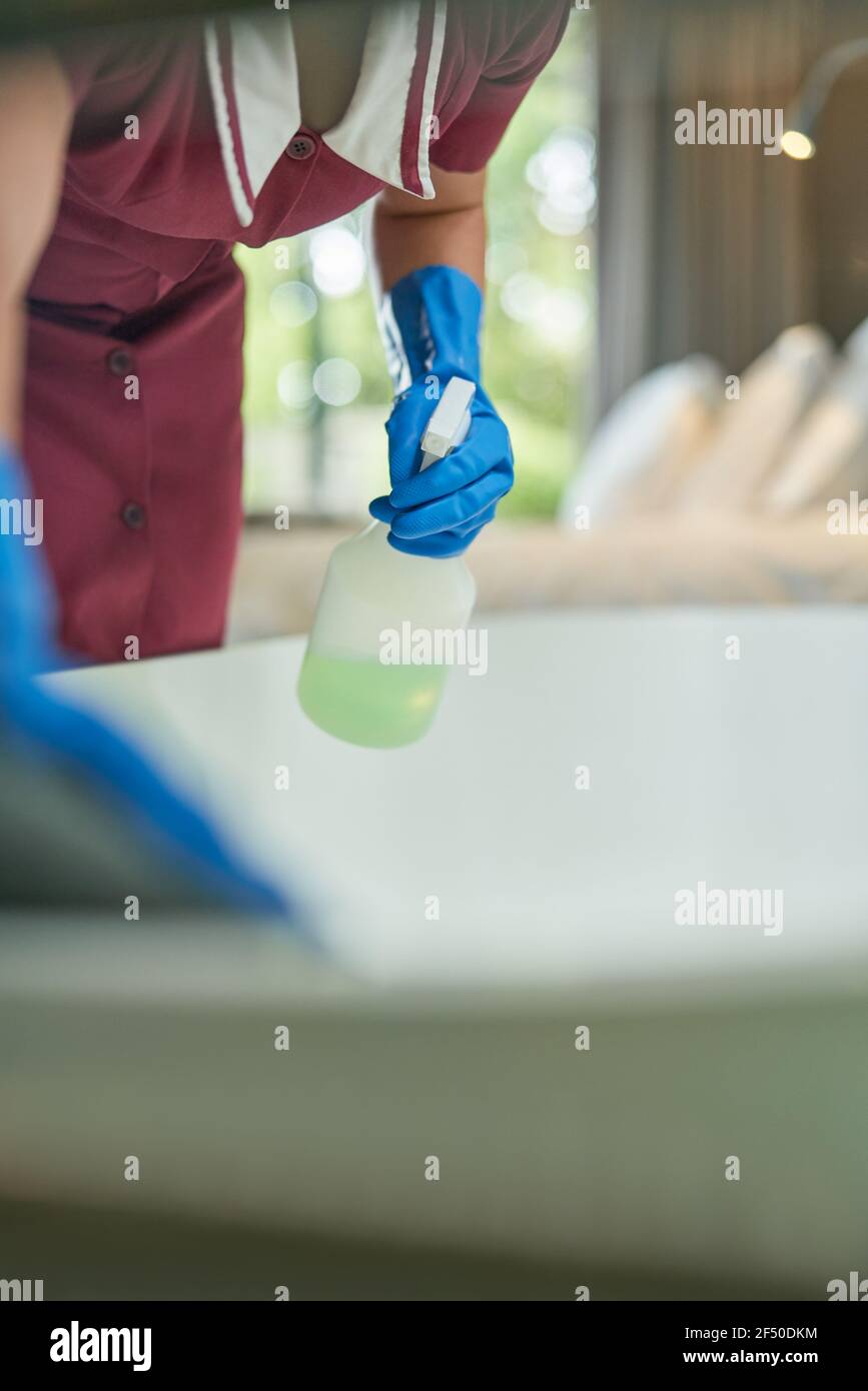 Hotel maid cleaning bathtub in hotel room Stock Photo Alamy