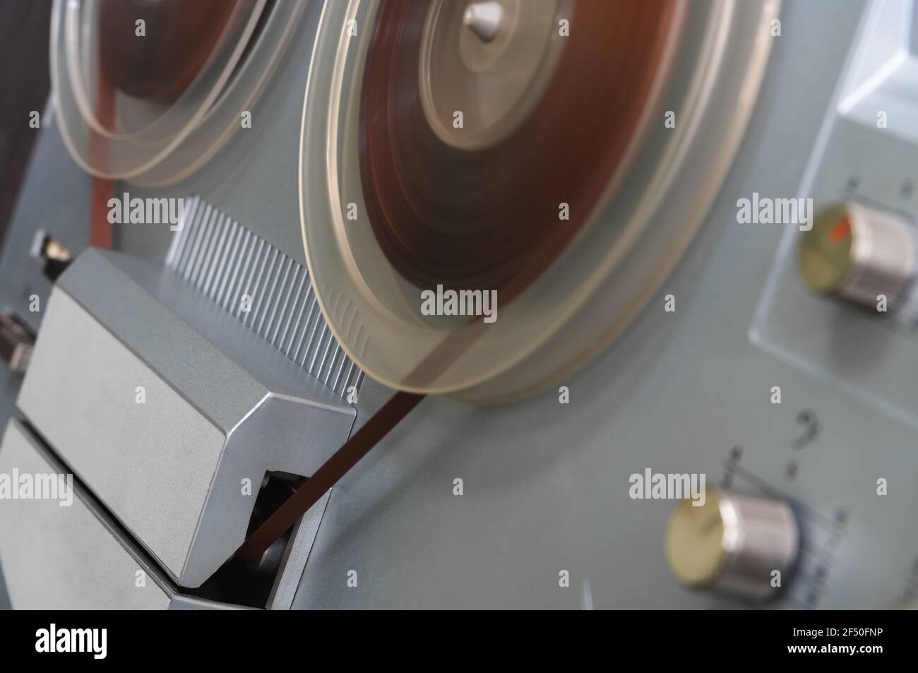 Old vintage reeltoreel player. Tape recorder with spools. Bobbin tape