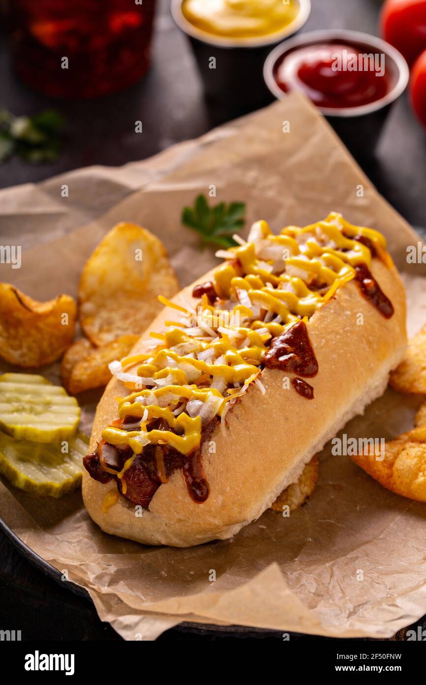 Chili hot dog with onion and mustard Stock Photo Alamy