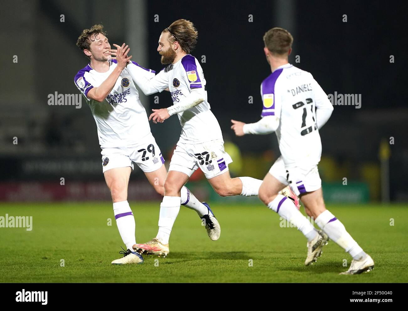Shrewsbury Town's Harry Chapman (centre) celebrates scoring their side's second goal of the game with team-mates Matthew Pennington (left) and Josh Daniels during the Sky Bet League One match at the Pirelli Stadium, Burton upon Trent. Picture date: Tuesday March 23, 2021. Stock Photo