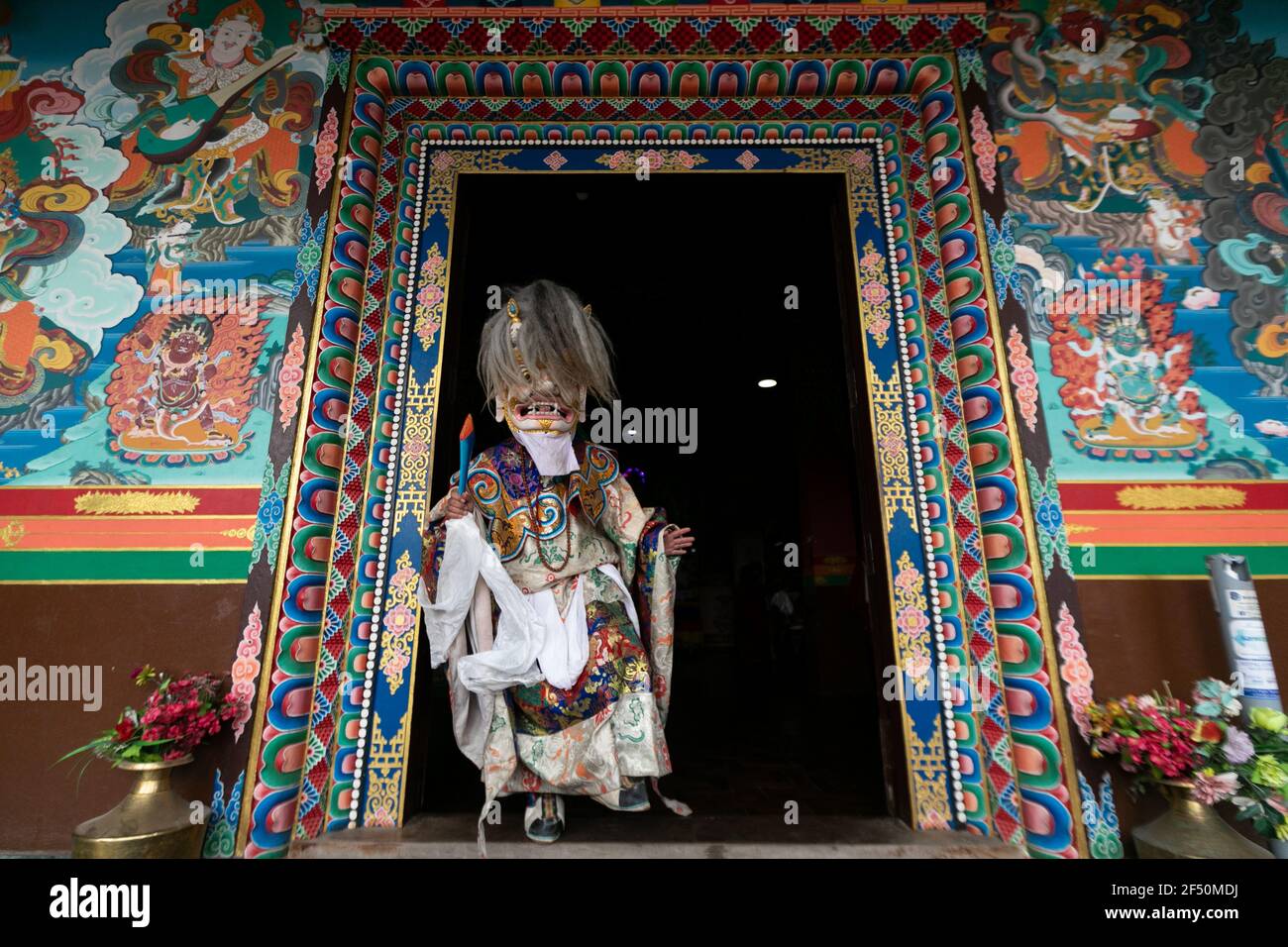 A masked dancer performs a traditional Cham dance during the rituals ...