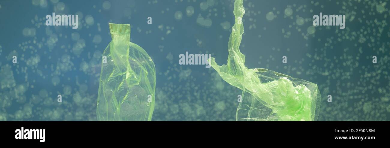 cellophane rubbish in water, ecology concept, banner Stock Photo