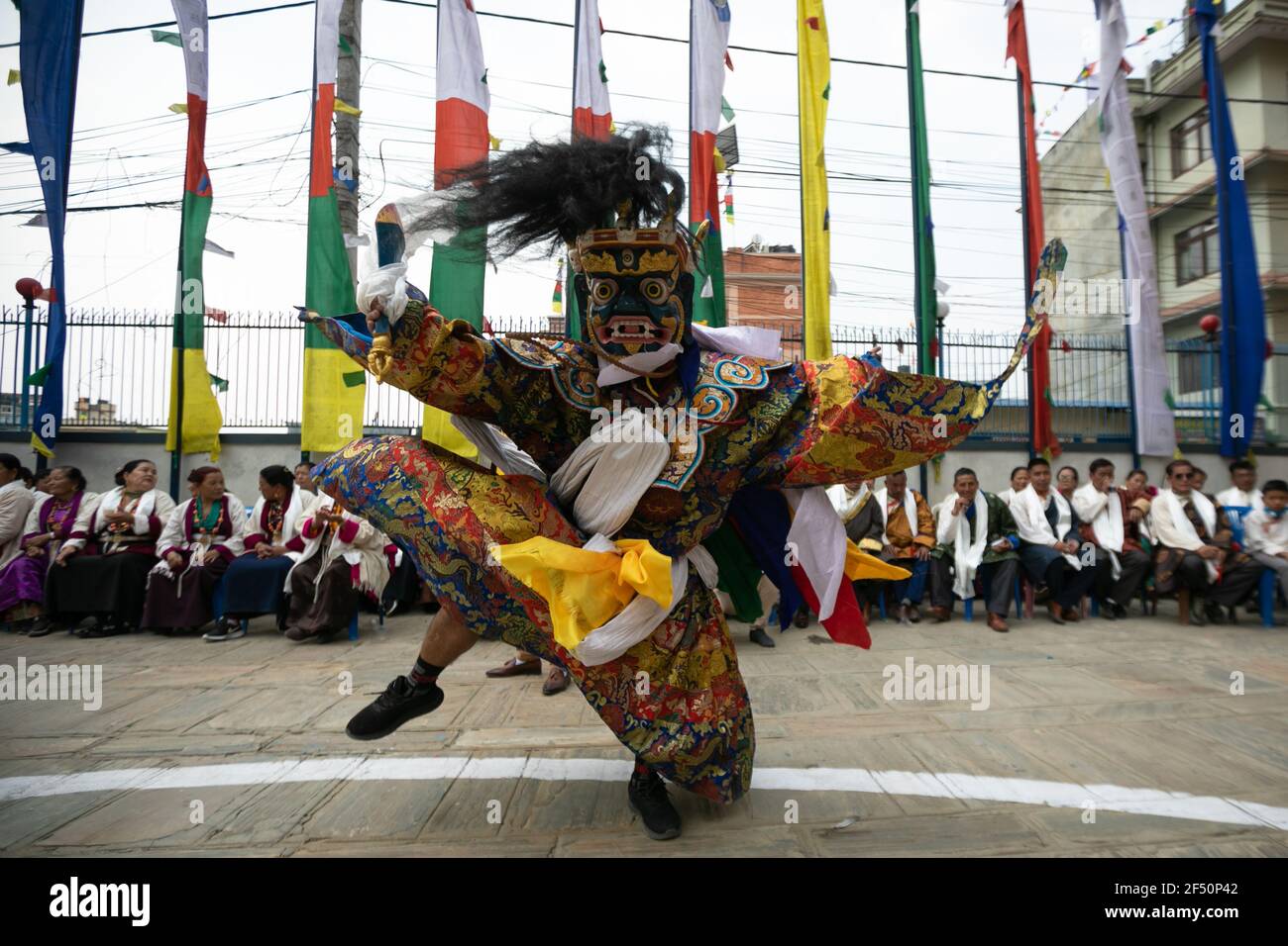A masked dancer performs a traditional Cham dance during the rituals ...