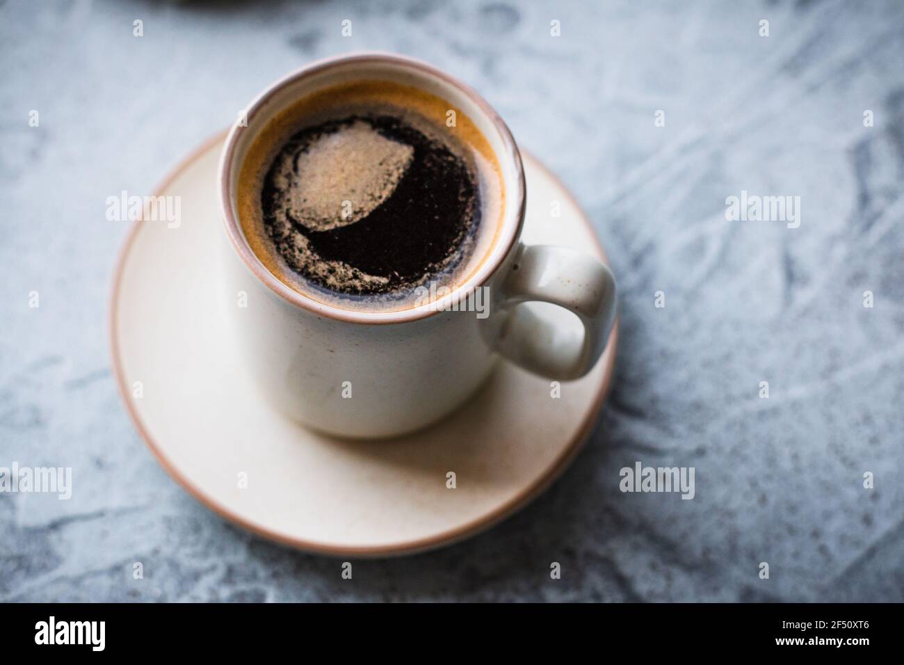 https://c8.alamy.com/comp/2F50XT6/close-up-top-view-of-an-espresso-cup-containing-a-cuban-coffee-2F50XT6.jpg