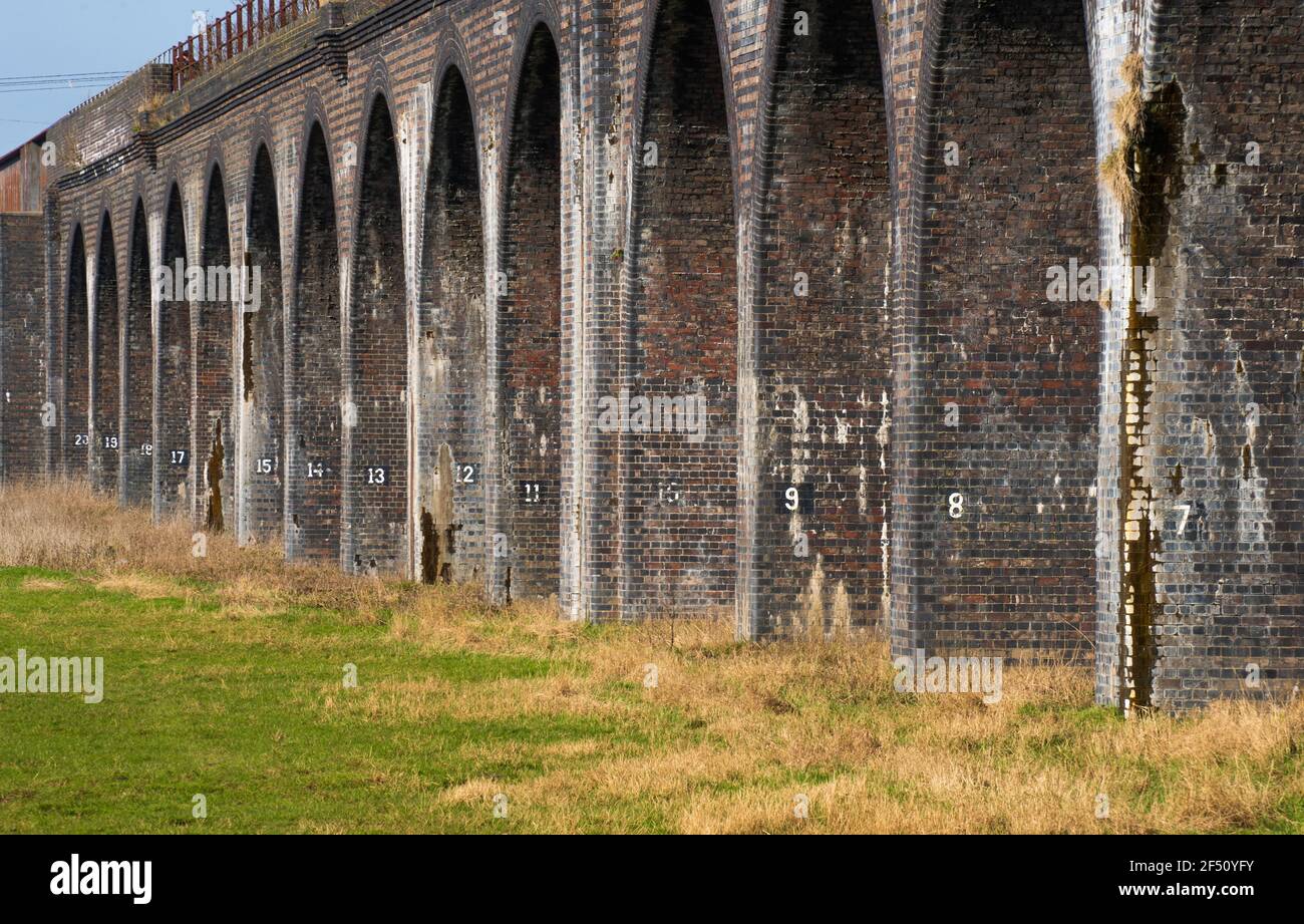Fledborough Viaduct, River Trent, abandoned railway, viaduct, Graffiti bridge, former railway, numbered pillars, maintenance, Victorian structure. Stock Photo