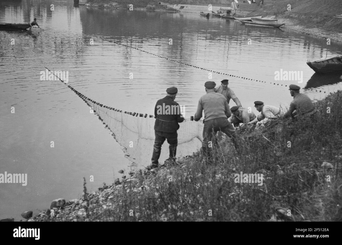 Riesa-Gr? Ba. Fisherman at the harbor fishing (Image 1 of 4) Riesa Gröba. Fisherman at the harbor fishing (Image 1 of 4) Stock Photo