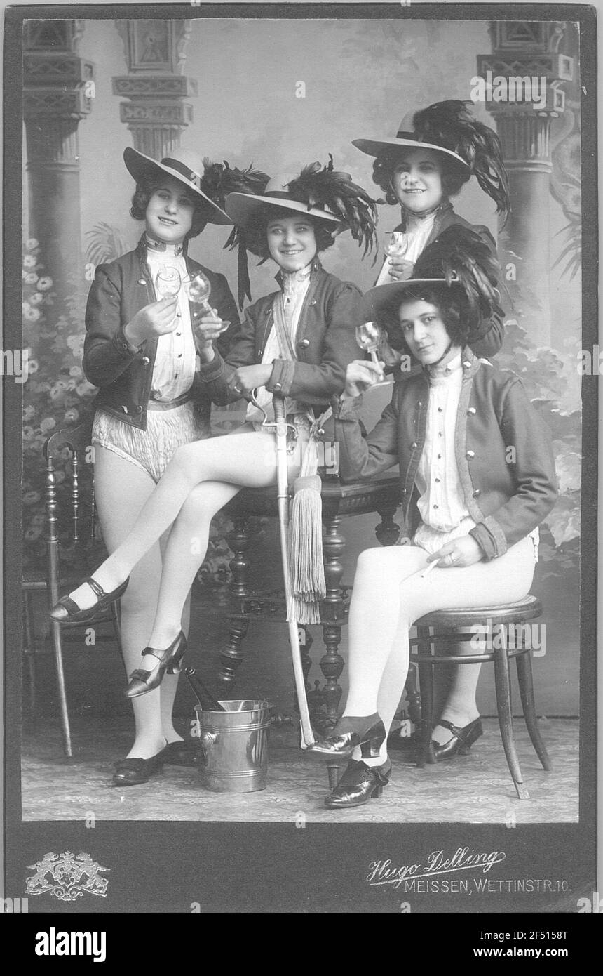 Four young women (Revuegirls?) In costumes with pantyhose, uniform jackets  and spring hats, taken in the studio of photographer in Meissen,  Wettinstraße 10 Stock Photo - Alamy