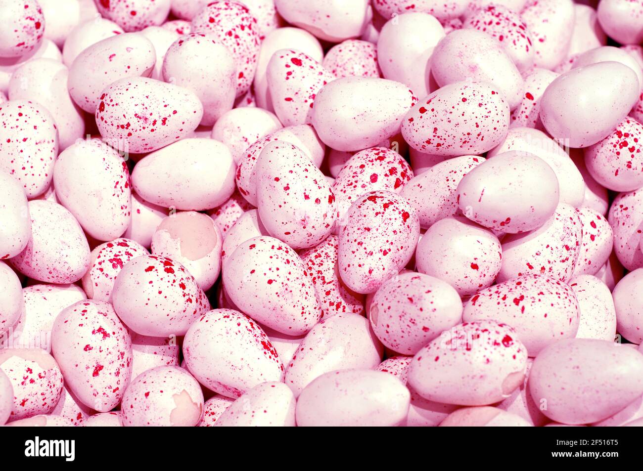 Pink chocolate eggs background. Easter background. Top view. Speckled Easter Eggs Stock Photo