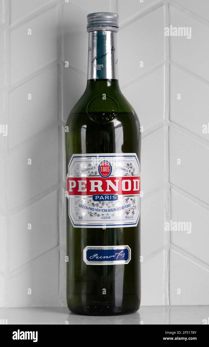 bottle of Pernod aniseed liquer, a classic, popular Parisian brand of absinthe liquer over 200 years old, with clipping path Stock Photo