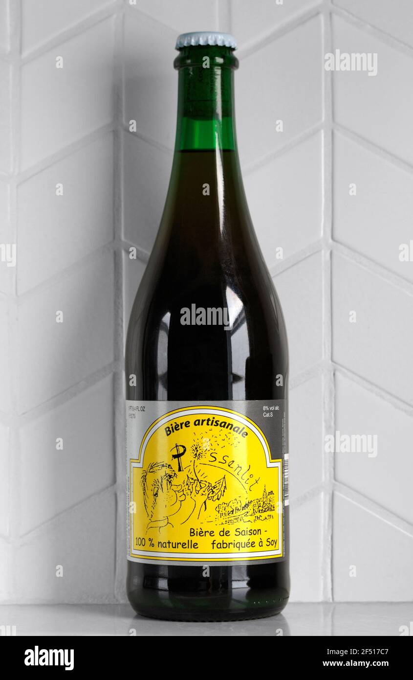 bottle of Fantome Pissenlit Farmhouse Ale - Saison style Belgian artesanal beer, made by Brasserie Fantome in Soy, Belgium, with clipping path Stock Photo