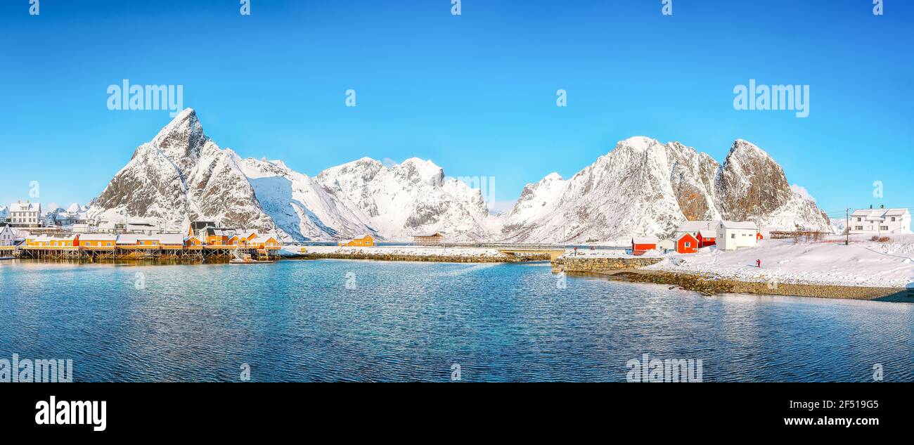 Beathtaking winter view of Sakrisoy village and snowy mountaines on background. Popular tourist destination on Lofotens.   Location: Sakrisoy , Mosken Stock Photo