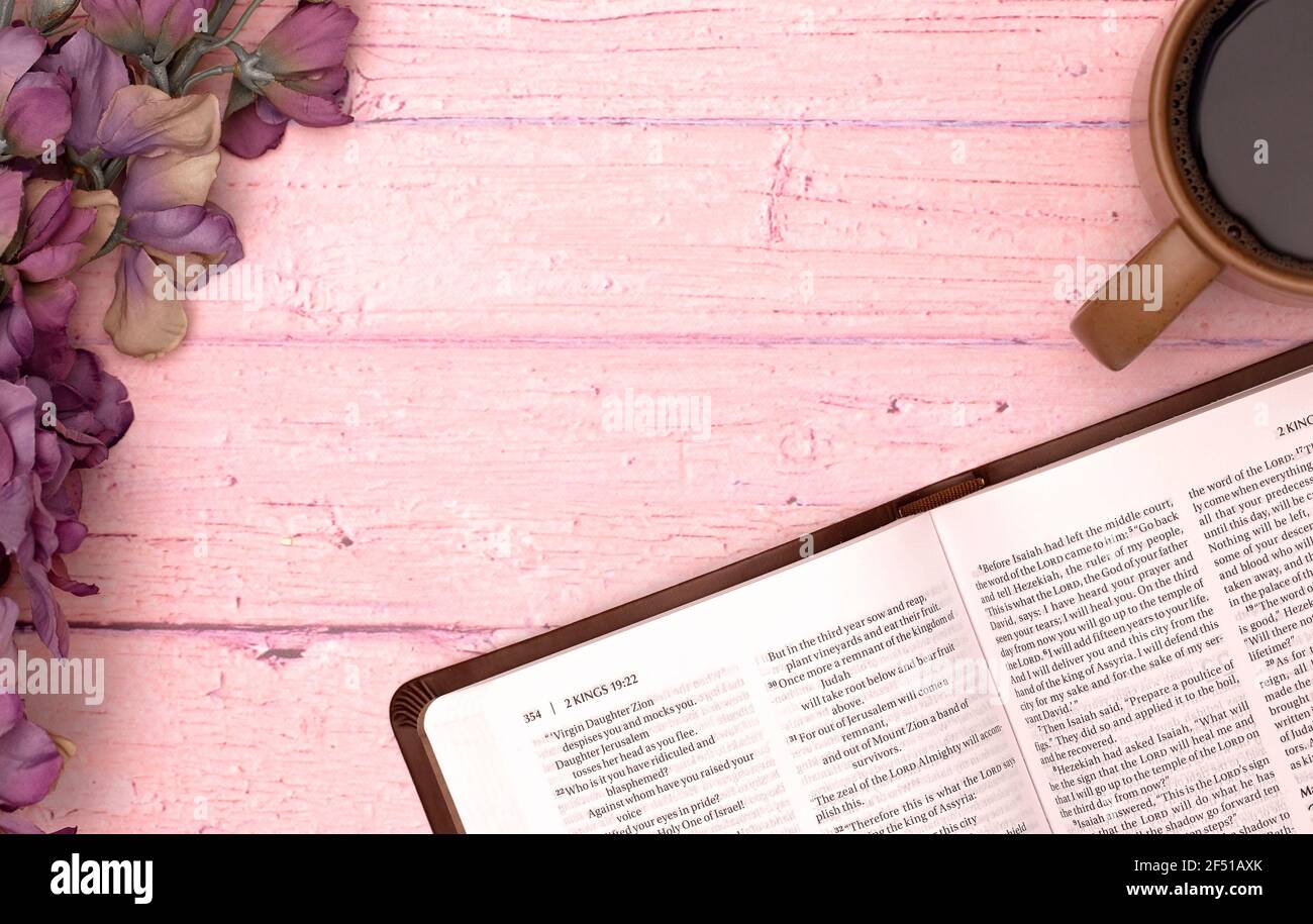 Personal Bible Study with a Cup of Hot Coffee on a Pink Table Stock Photo