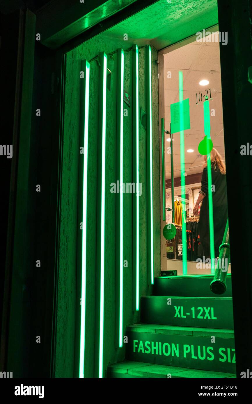Large size clothing store xl 12xl green neon corridor entrance