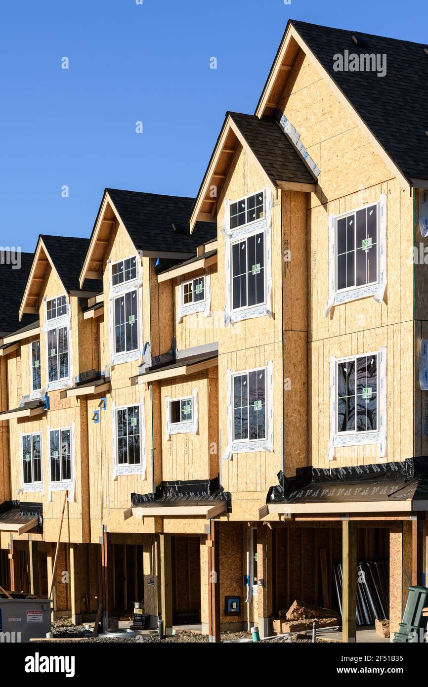 Row of wood townhomes under construction in rural Duvall Washington