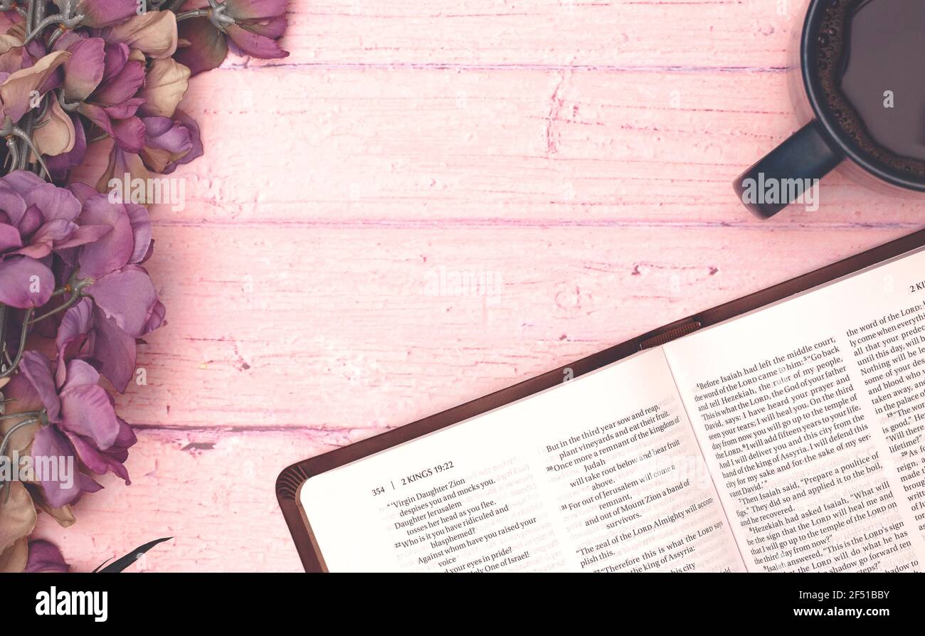 Personal Bible Study with a Cup of Hot Coffee on a Pink Table Stock Photo