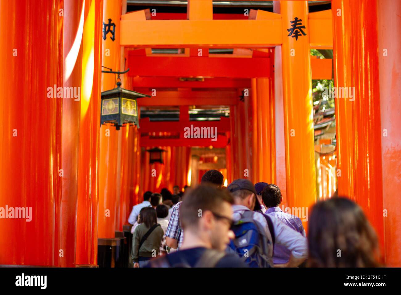 As you walk through the torii, it's believed that you express your worship as you aproach the inner shrine. Stock Photo