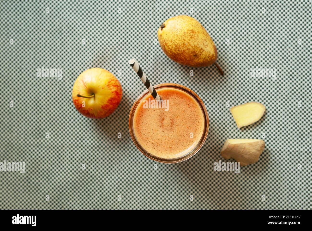 Top view of homemade apple and pear juice with ginger. Juice diet