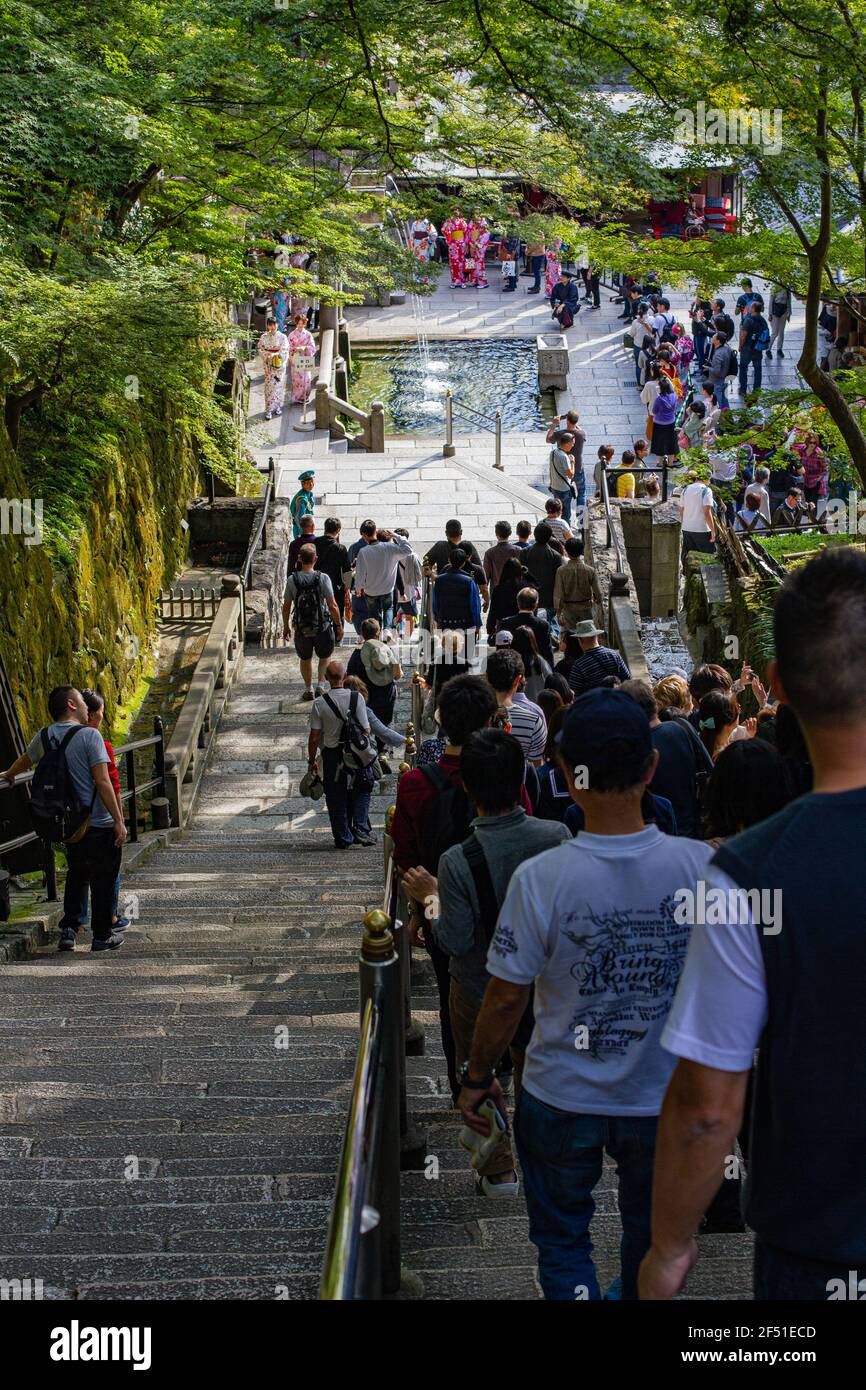 People lining up to take part in the ritual at Otowa no Taki Stock Photo