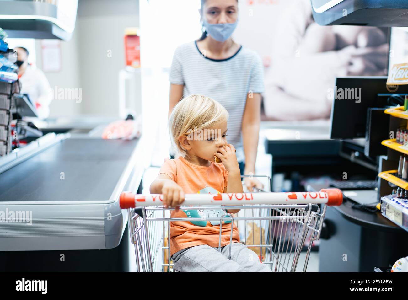 Budva, Montenegro - 17 march 2021: A child with a small trolley in the  supermarket, go shopping with his mother. The family goes shopping Stock  Photo - Alamy