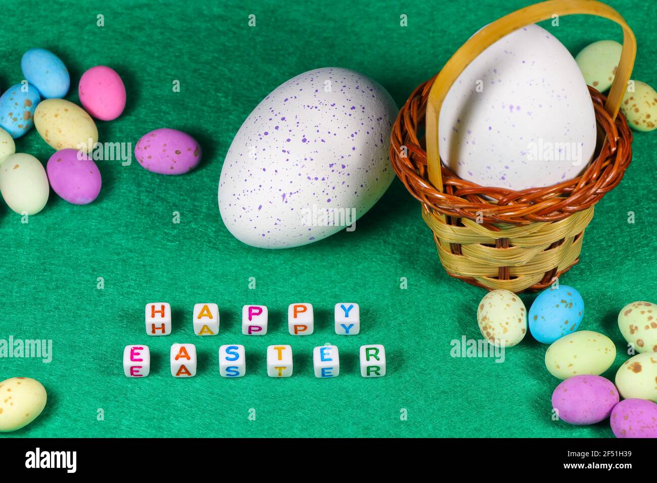 Happy Easter Speckled Candy Eggs With Weave Basket Stock Photo
