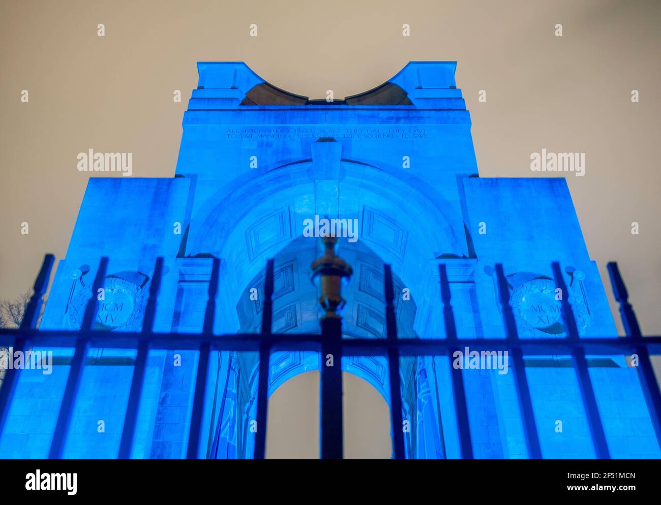 Covid-19 coronavirus pandemic. One Year On: Leicester Remembers. The city that has suffered the worst lockdown restrictions in the UK marks one year of lockdown by illuminating Leicester War Memorial in blue light in honour of NHS and all key workers. Stock Photo