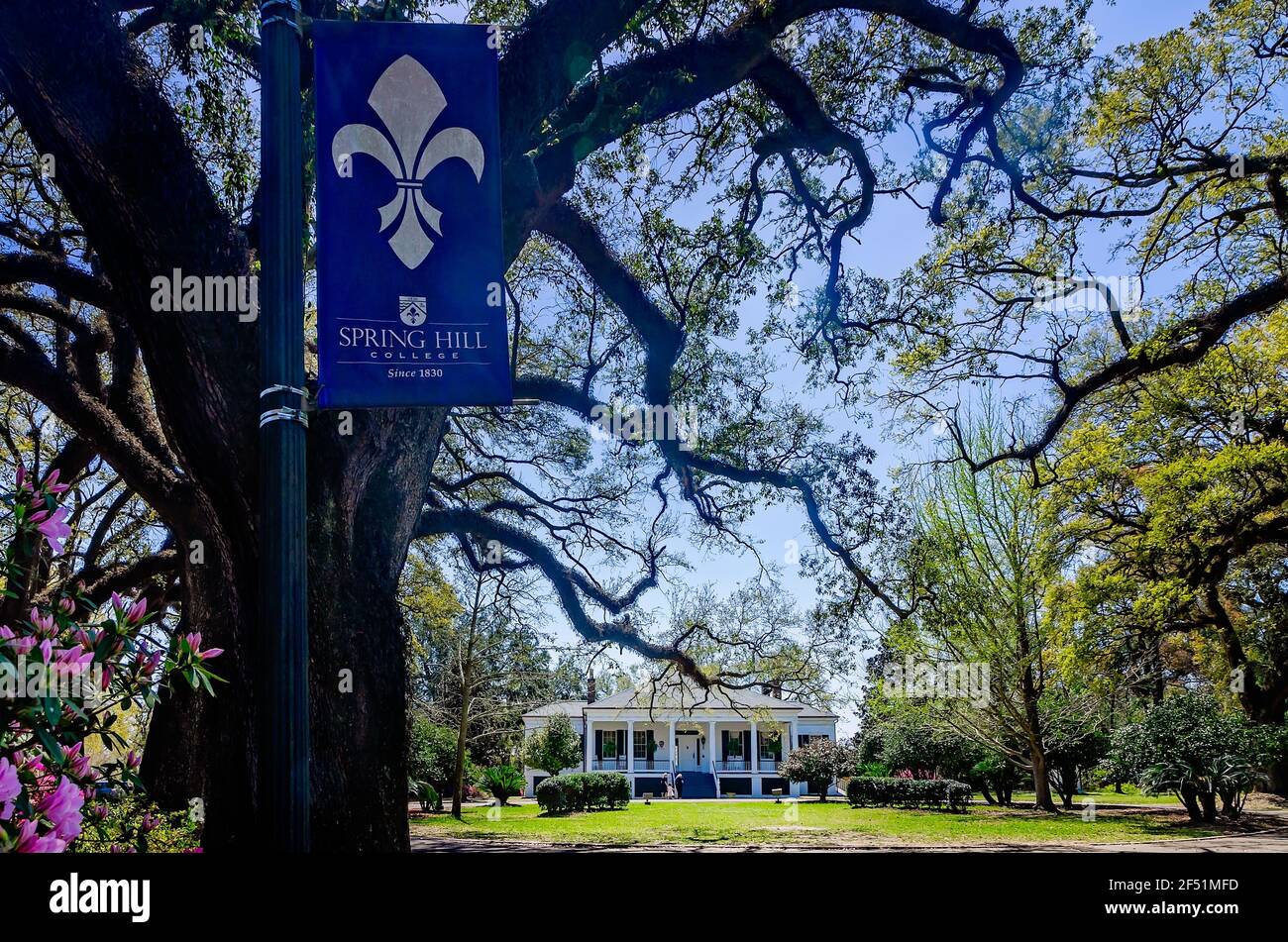 Stewartfield, an 1849 Greek Revival cottage, is pictured on the Avenue of Oaks at Spring Hill College, March 21, 2021, in Mobile, Alabama. Stock Photo