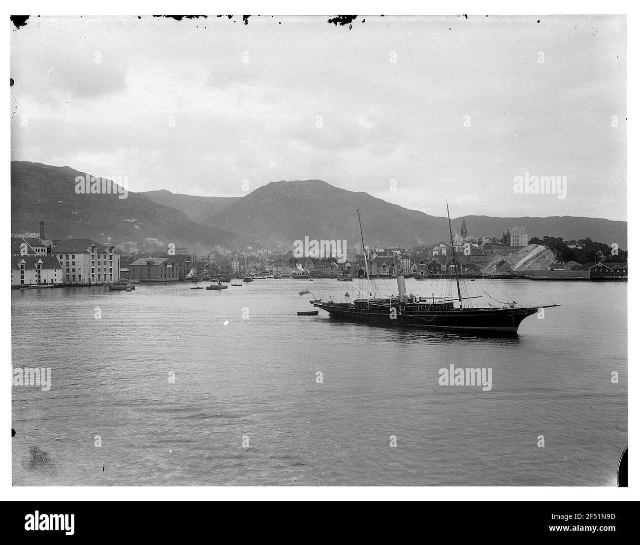 Mountains. Fjord steamer in front of the coast of the city Stock Photo