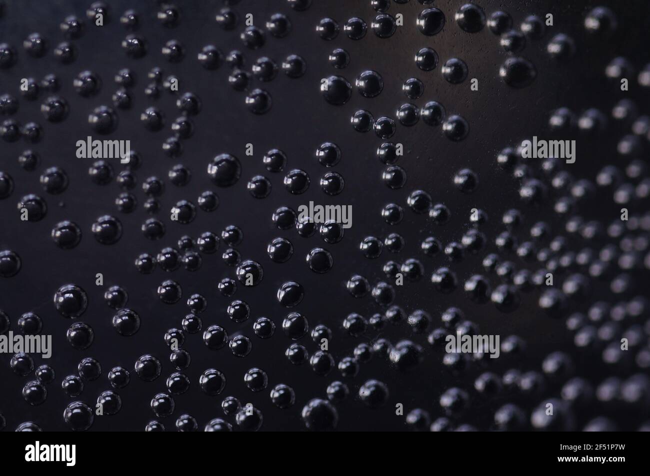Close-up of gas bubbles in water. Soda water on close-up. Carbonated water on a dark background. Background with bubbles of carbonated water. Stock Photo