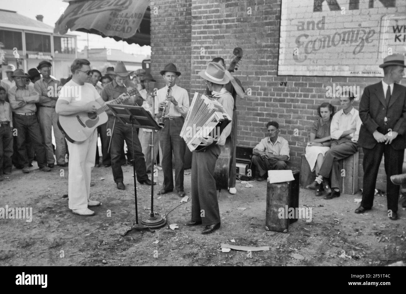 Orchestra playing outside a grocery store on Saturday afternoon which is designed to attract customers to the store, Phoenix, Arizona - 1940 Stock Photo