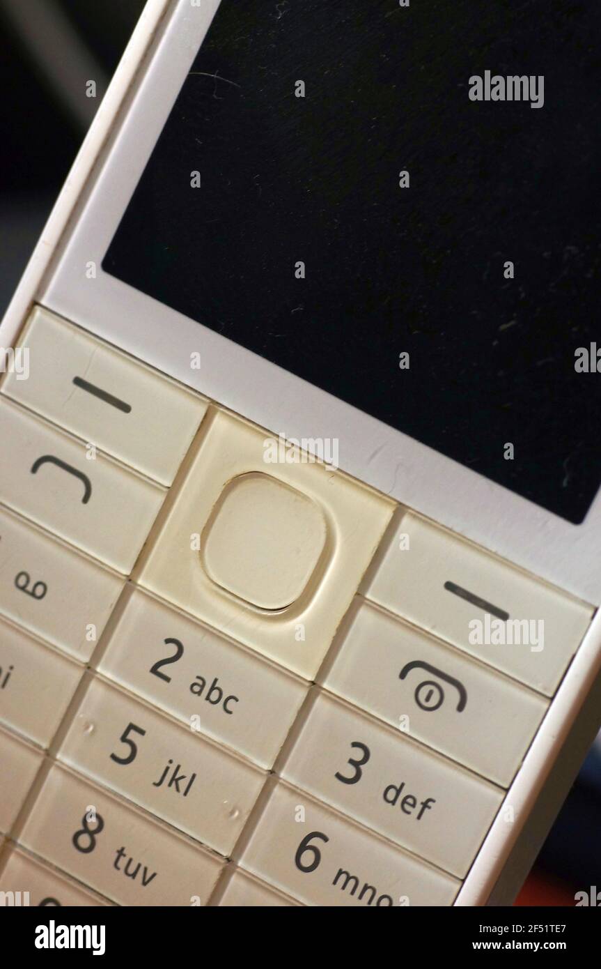 White phone keyboard old generation. Bright white key with numbers