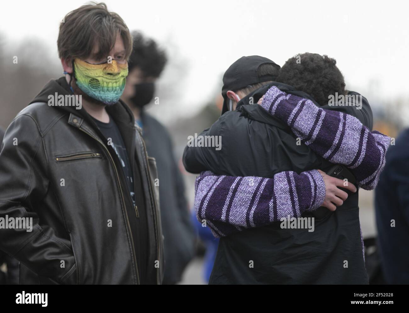 Boulder, United States. 23rd Mar, 2021. A man is comforted after laying flowers outside a King Soopers grocery store where 10 people, including a police officer, were killed in a shooting Monday, in Boulder, Colorado, on Tuesday, March 23, 2021. Police said a suspect, identified as Ahmad Al Aliwi Alissa, was in custody and charged with 10 counts of first-degree murder. Photo by Bob Strong/UPI Credit: UPI/Alamy Live News Stock Photo