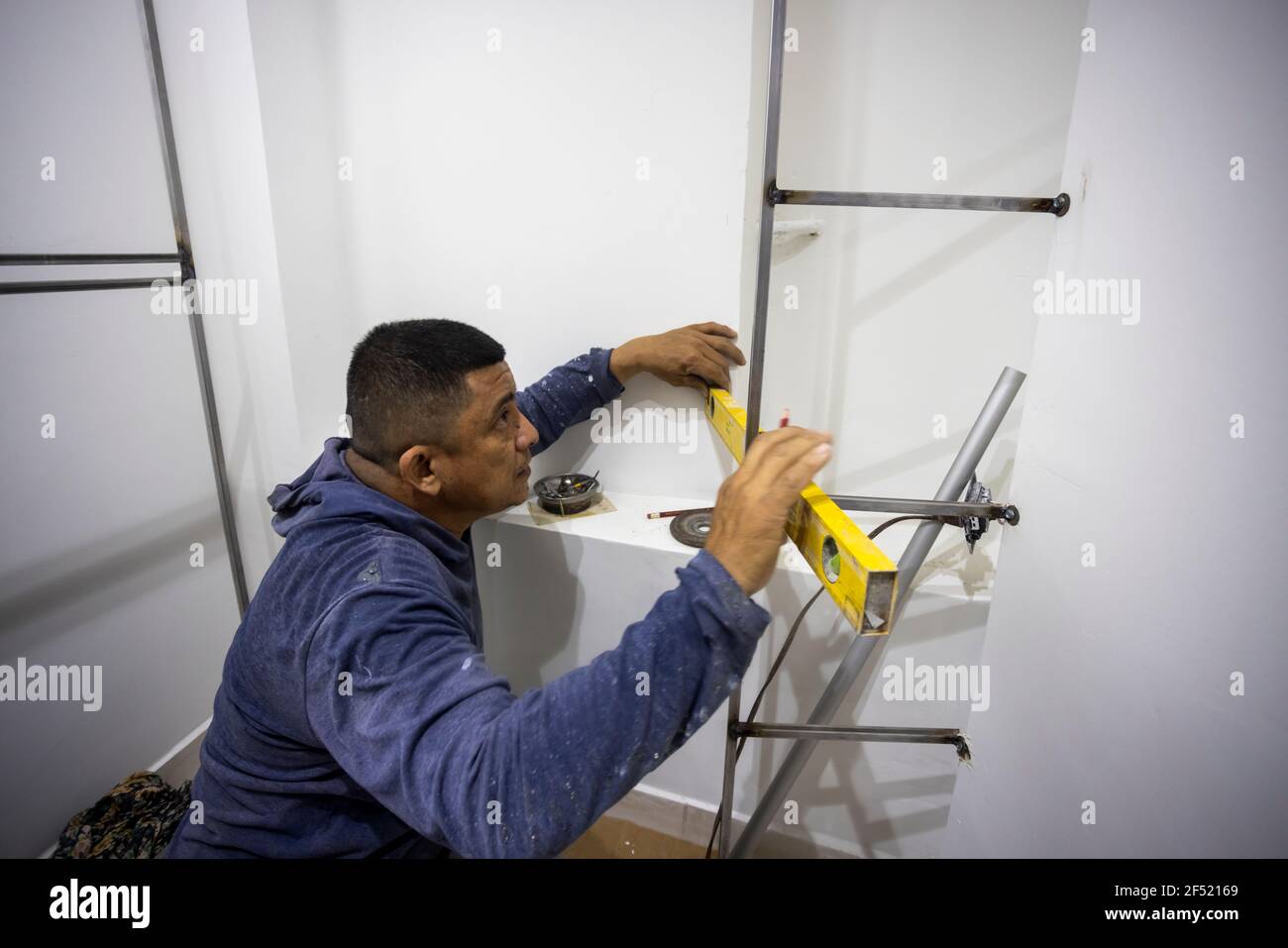 Colombian metalworker preparing the metal structure during work Stock Photo