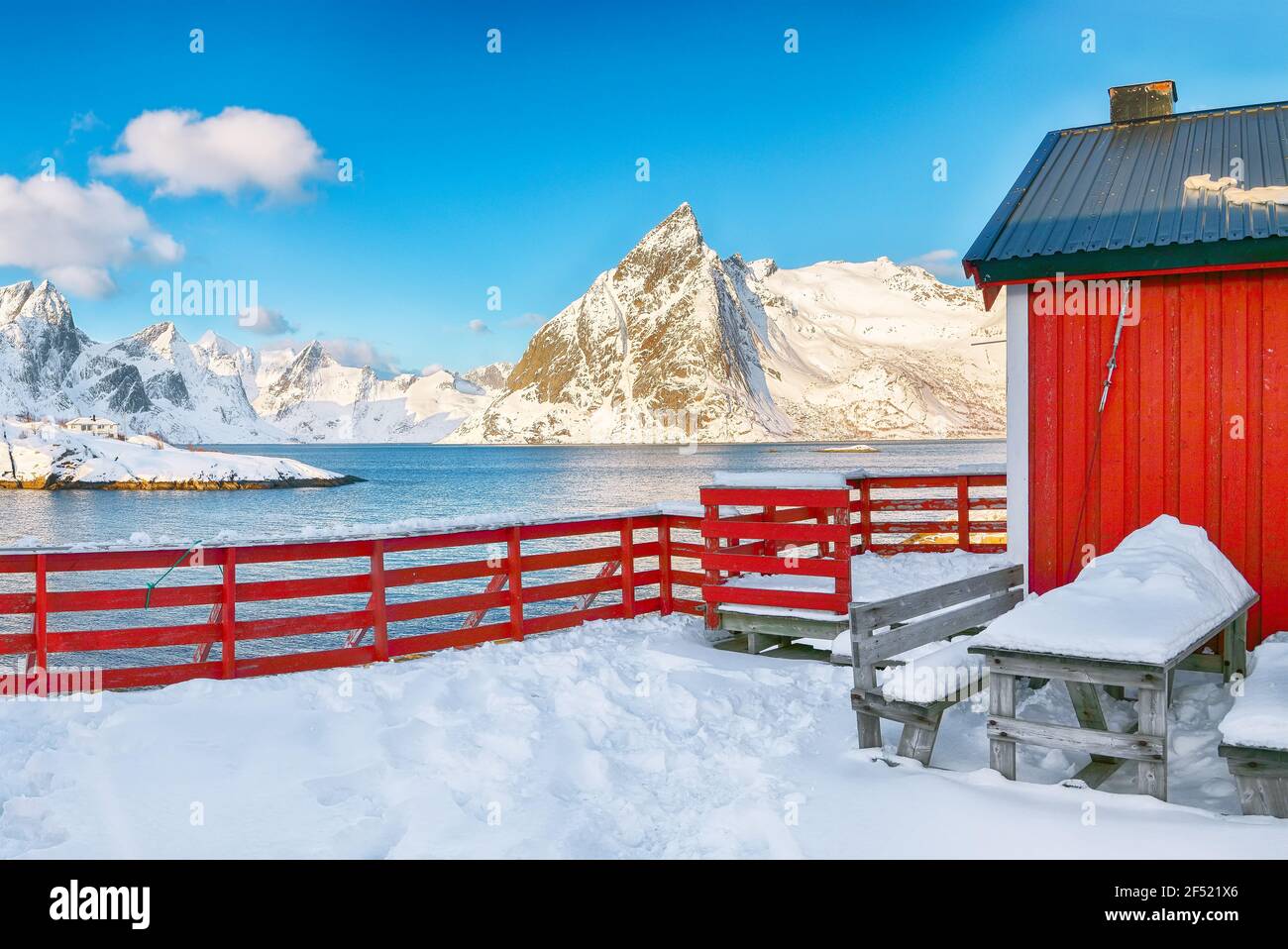 Traditional Norwegian red wooden houses on the shore of Reinefjorden in