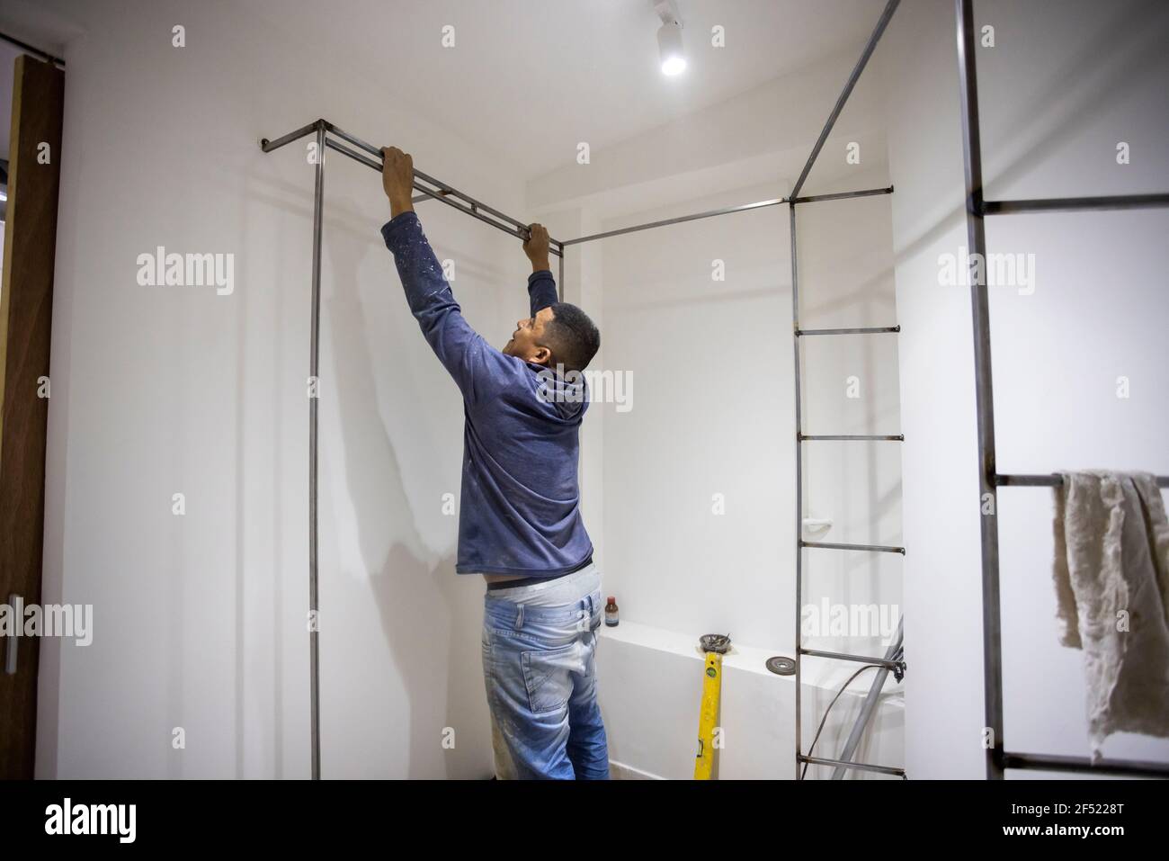 Colombian metalworker preparing the metal structure during work Stock Photo