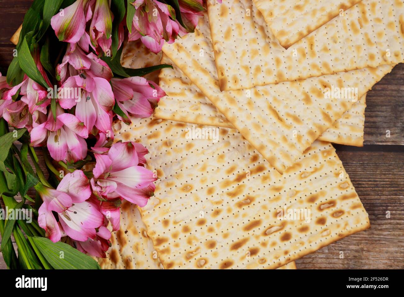Jewish matzah bread on wooden rustic background. Passover holiday ...